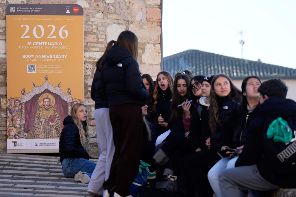 Pilgrims leave after they honored the bones of St. Francis during the first public display inside the St. Francis Basilica, marking the 800th anniversary of the saint's death, in Assisi, Italy, Sunday, Feb. 22, 2026.(AP Photo/Gregorio Borgia)