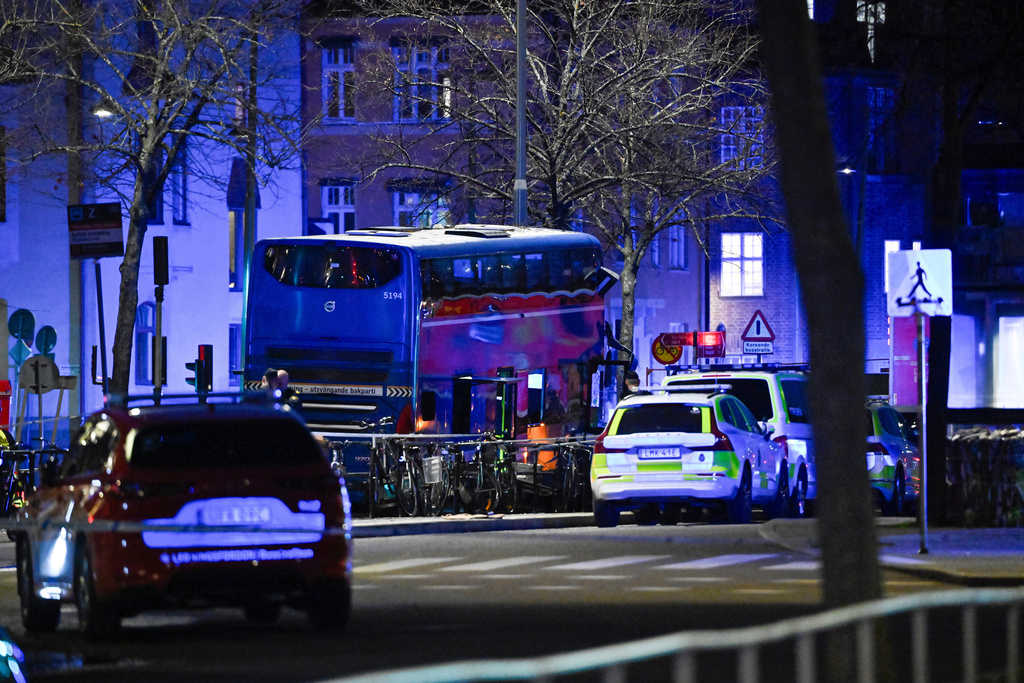A double-decker bus crashed into a bus shelter in Stockholm on Friday, Nov. 14, 2025, causing fatalities and injuries. (Henrik Montgomery/TT News Agency via AP)