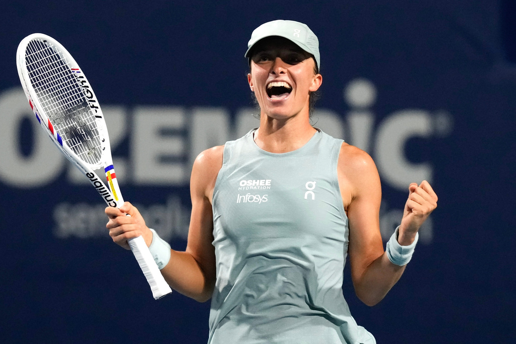 Poland's Iga Swiatek celebrates her 6-3 1-6 6-3 win over Ukraine's Elina Svitolina in a National Bank Open semifinal tennis match in Toronto on Wednesday, August 12, 2026. (Chris Young/The Canadian Press via AP)