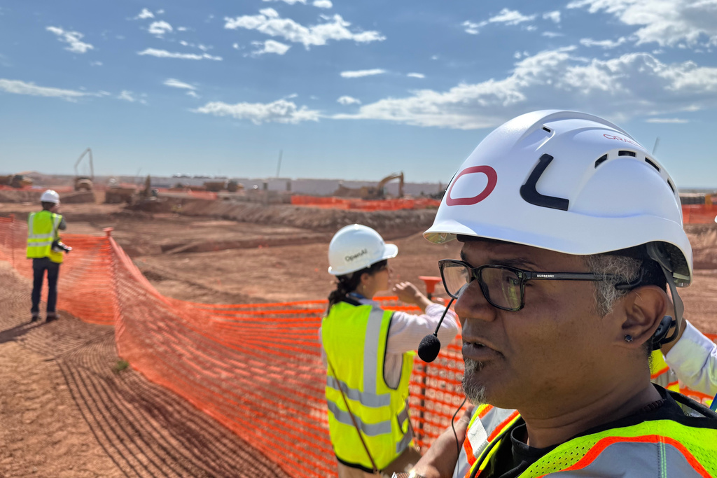 Mahesh Thiagarajan, executive vice president of Oracle Cloud Infrastructure, shows media the Stargate artificial intelligence data center project in Abilene, Texas on Tuesday Sept. 23, 2025. (AP Photo/Matt O’Brien)