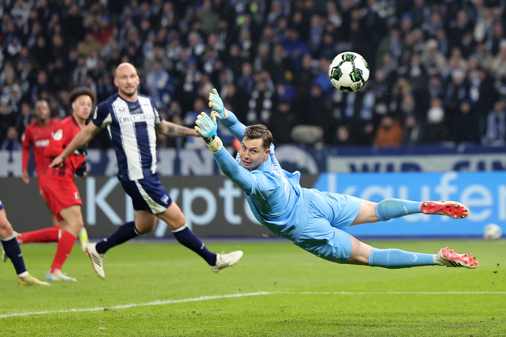 Freiburg goalkeeper Florian Müller looks back as shot by Hertha Berlin goes wide during the German Cup quarterfinal soccer match between Hertha Berlin and SC Freiburg in Berlin, Tuesday, Feb. 10, 2026. (Andreas Gora/dpa via AP)