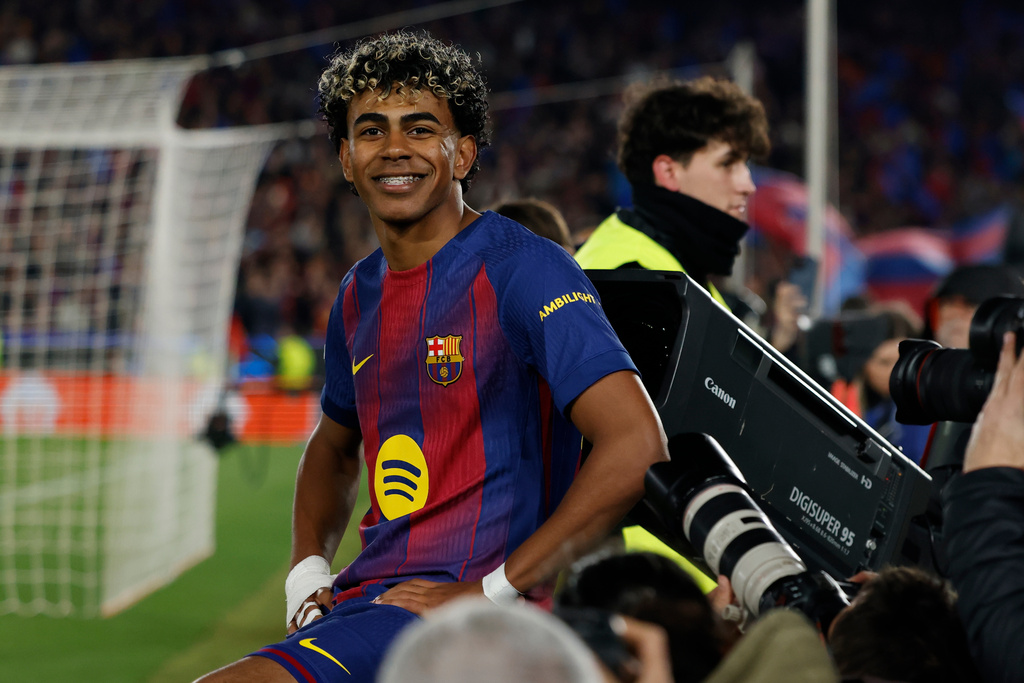 Barcelona's Lamine Yamal celebrates after scoring a penalty, his side's third goal during the Champions League round of 16, second leg soccer match between FC Barcelona and Newcastle United FC in Barcelona, Spain, Wednesday, March 18, 2026. (AP Photo/Joan Monfort)