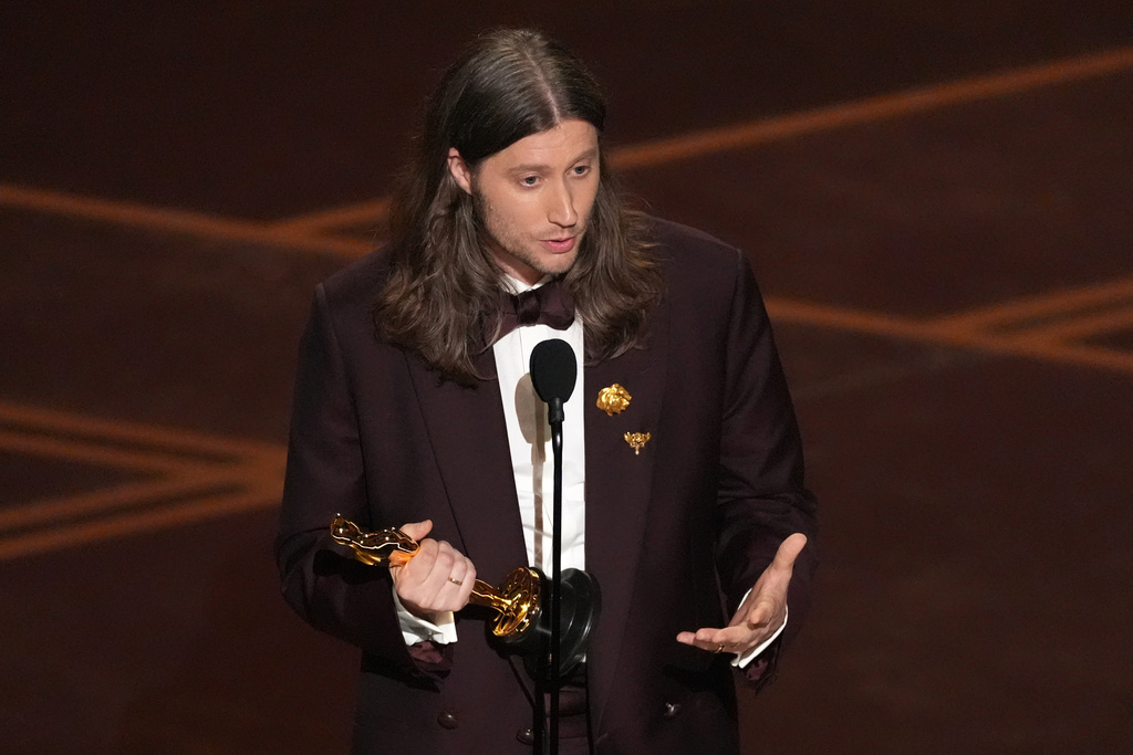 Ludwig Göransson accepts the award for music (original score) for "Sinners" during the Oscars on Sunday, March 15, 2026, at the Dolby Theatre in Los Angeles. (AP Photo/Chris Pizzello)