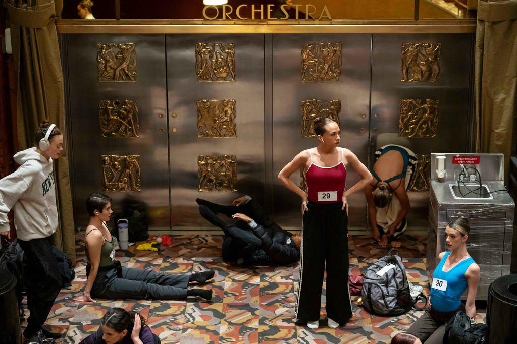 Dancers warm up and stretch before an audition for the Radio City Rockettes at Radio City Music Hall in New York, on Wednesday, April 22, 2026. (AP Photo/Yuki Iwamura)