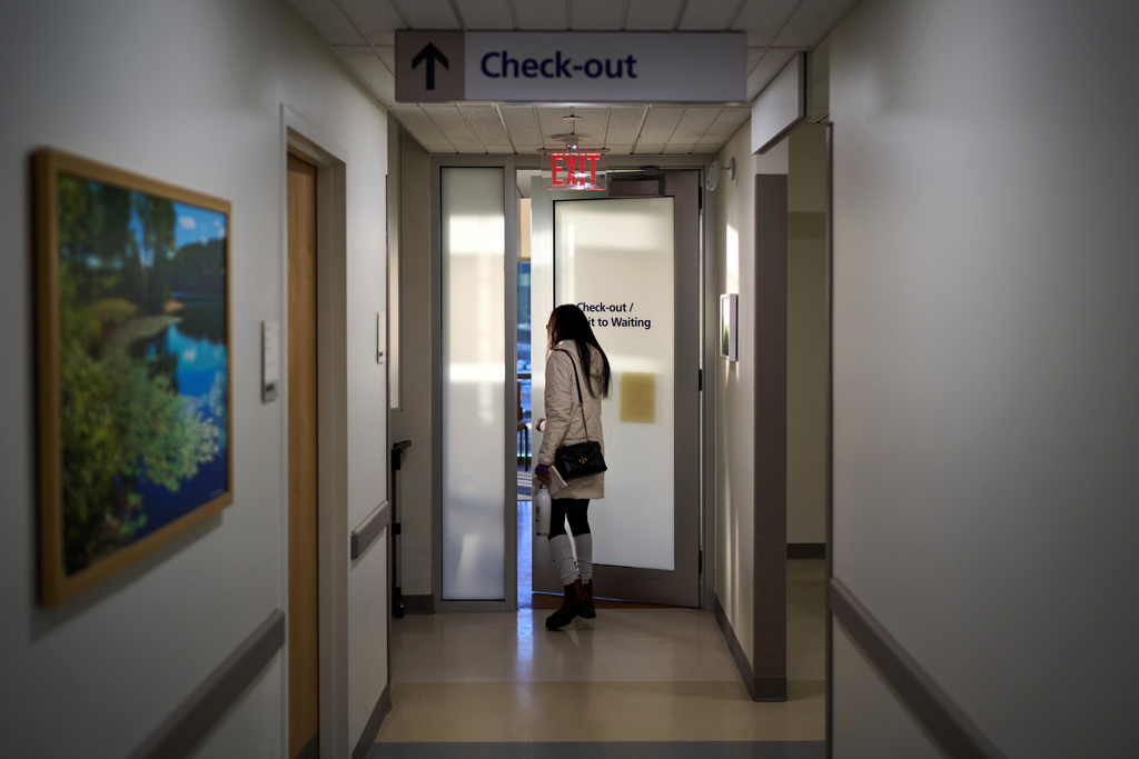 Ruth Wilson, who has lupus, leaves her monthly lupus-focused IV treatment at UMass Memorial Medical Center, Tuesday, Jan. 14, 2025, in Worcester, Mass. (AP Photo/David Goldman)