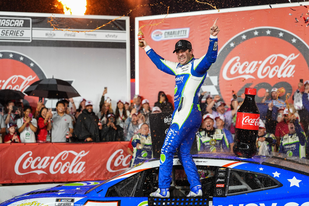 Daniel Suarez celebrates in Victory Lane after winning a NASCAR Cup Series auto race, Sunday, May 24, 2026, in Charlotte, N.C. (AP Photo/Matt Kelley)