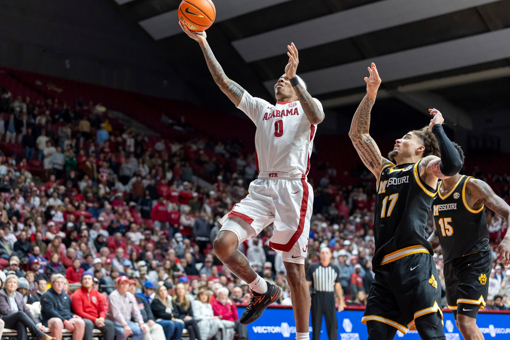 Alabama guard Labaron Philon Jr. (0) gets by Missouri guard Jayden Stone (17) for a shot during the second half of an NCAA college basketball game Tuesday, Jan. 27, 2026, in Tuscaloosa, Ala. (AP Photo/Vasha Hunt)