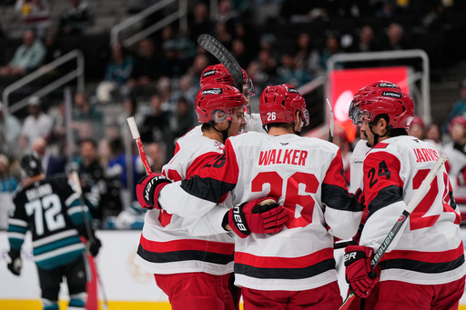 Carolina Hurricanes defenseman Sean Walker (26) celebrates with teammates after scoring a goal during the second period of an NHL hockey game against the San Jose Sharks, Tuesday, Oct. 14, 2025, in San Jose, Calif. (AP Photo/Godofredo A. Vásquez) Carolina Hurricanes defenseman Sean Walker (26) celebrates with teammates after scoring a goal during the second period of an NHL hockey game against the San Jose Sharks, Tuesday, Oct. 14, 2025, in San Jose, Calif. (AP Photo/Godofredo A. Vásquez)