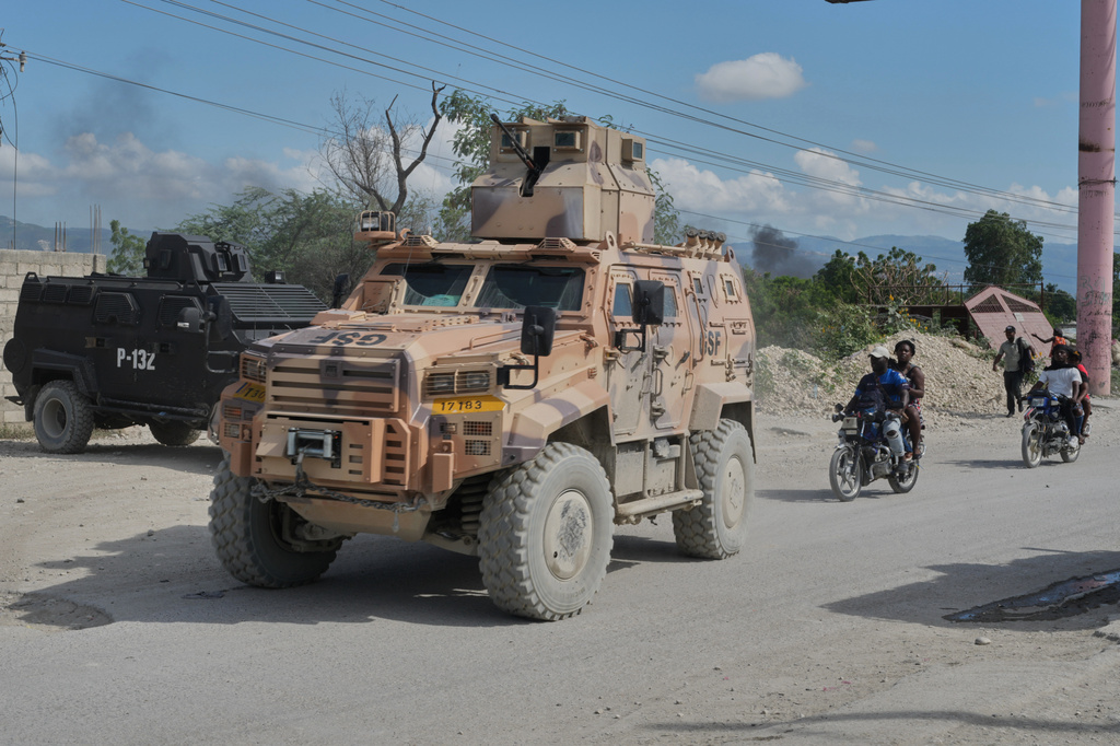 Armored police vehicles that are part of the Gang Suppression Force (GSF) patrol the Tabarre neighborhood of Port-au-Prince, Haiti, Monday, Oct. 19, 2026. (AP Photo/Odelyn Joseph)