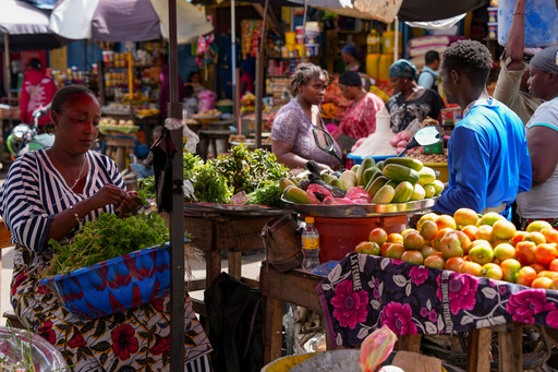 FILE - A vegetable seller sorts fresh produce at a market in Conakry, Guinea, Sept. 19, 2025 (AP Photo/Misper Apawu, File) FILE - A vegetable seller sorts fresh produce at a market in Conakry, Guinea, Sept. 19, 2025 (AP Photo/Misper Apawu, File)