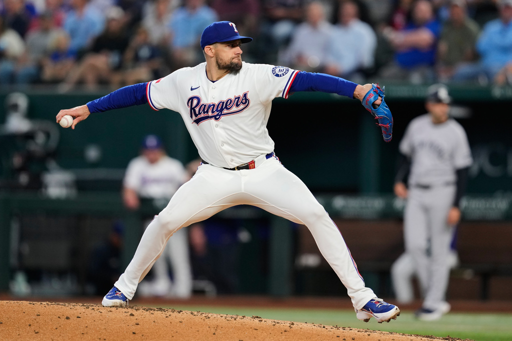 Texas Rangers pitcher Nathan Eovaldi throws to the New York Yankees in the third inning of a baseball game Wednesday, April 29, 2026, in Arlington, Texas. (AP Photo/Tony Gutierrez)