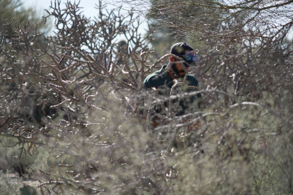Law enforcement agents check vegetation areas around Nancy Guthrie’s home in Tucson, Ariz., Wednesday, Feb. 11, 2026. (AP Photo/Ty ONeil)