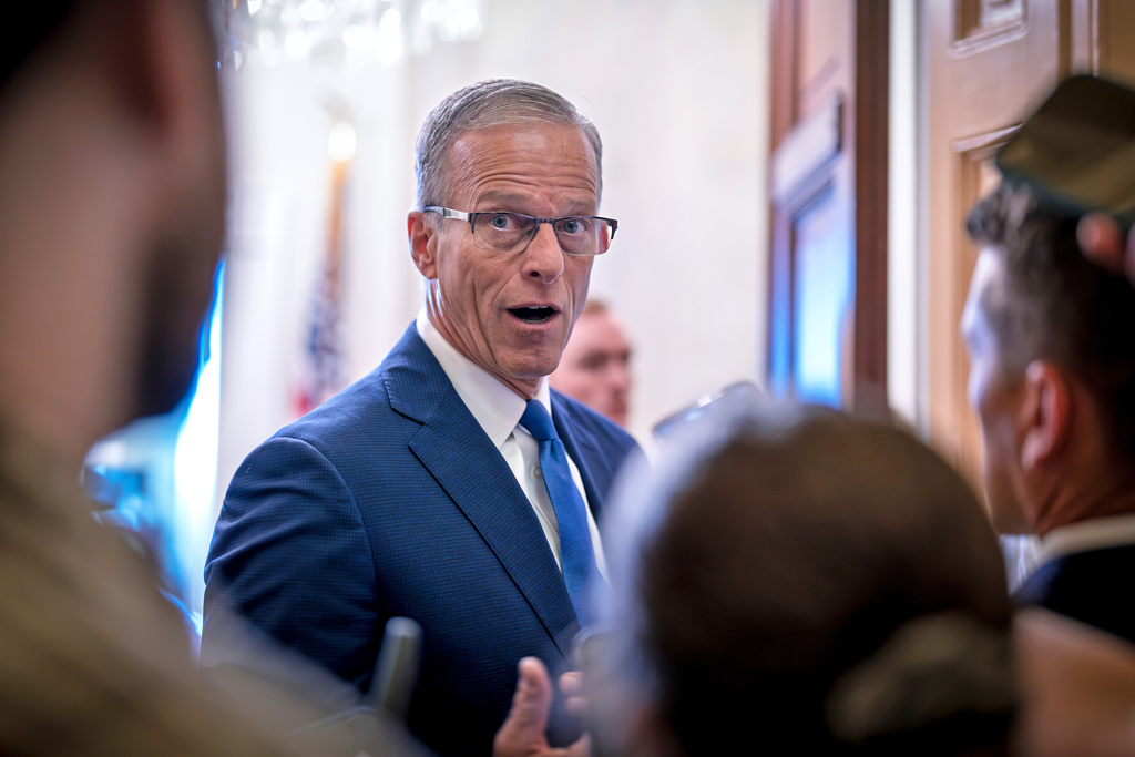 Senate Majority Leader John Thune, R-S.D., pauses to speak with reporters outside his office after opening the chamber on the seventh day of the government shutdown, at the Capitol in Washington, Tuesday, Oct. 7, 2025. (AP Photo/J. Scott Applewhite)