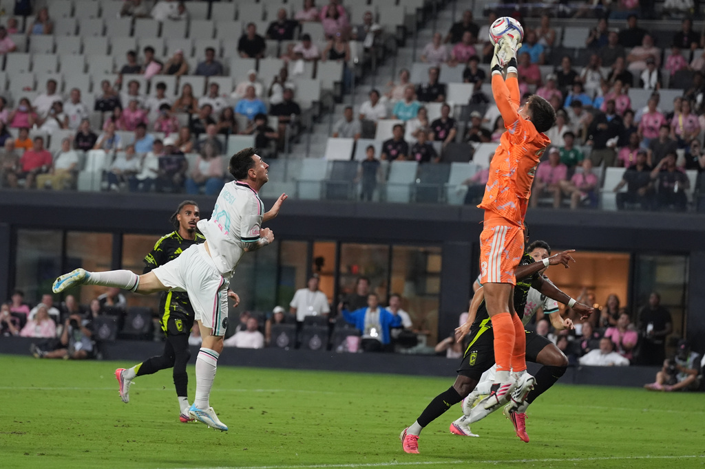Columbus Crew goalkeeper Patrick Schulte (28) grabs a shot by Inter Miami's Lionel Messi (10) during the second half of an MLS soccer match, Saturday, Aug. 1, 2026, in Miami, Fla. (AP Photo/Marta Lavandier)