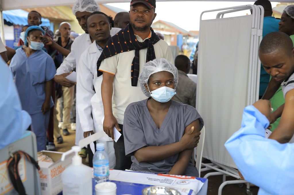 Health care workers queue to receive a dose of Ervebo vaccine against the Ebola virus in Beni, North Kivu province, eastern Congo, Friday, Oct. 16, 2026. (AP Photo/Sebastien Kitsa Musayi)