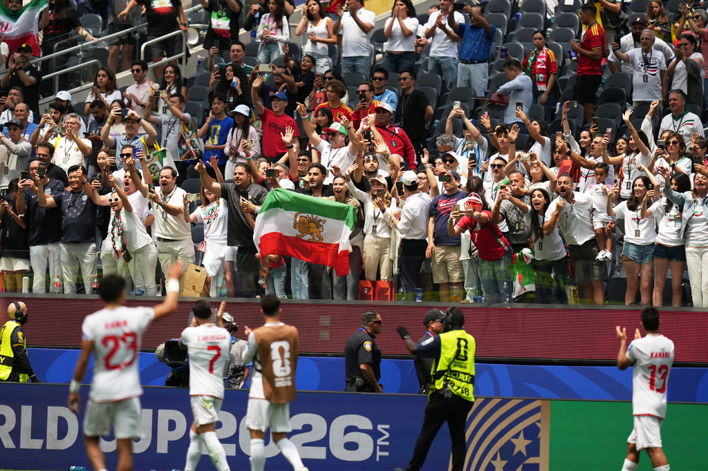 Players of Iran greet fans at the end of the World Cup Group G soccer match between Belgium and Iran in Inglewood, Calif., near Los Angeles, Sunday, June 21, 2026. (AP Photo/Andre Penner)