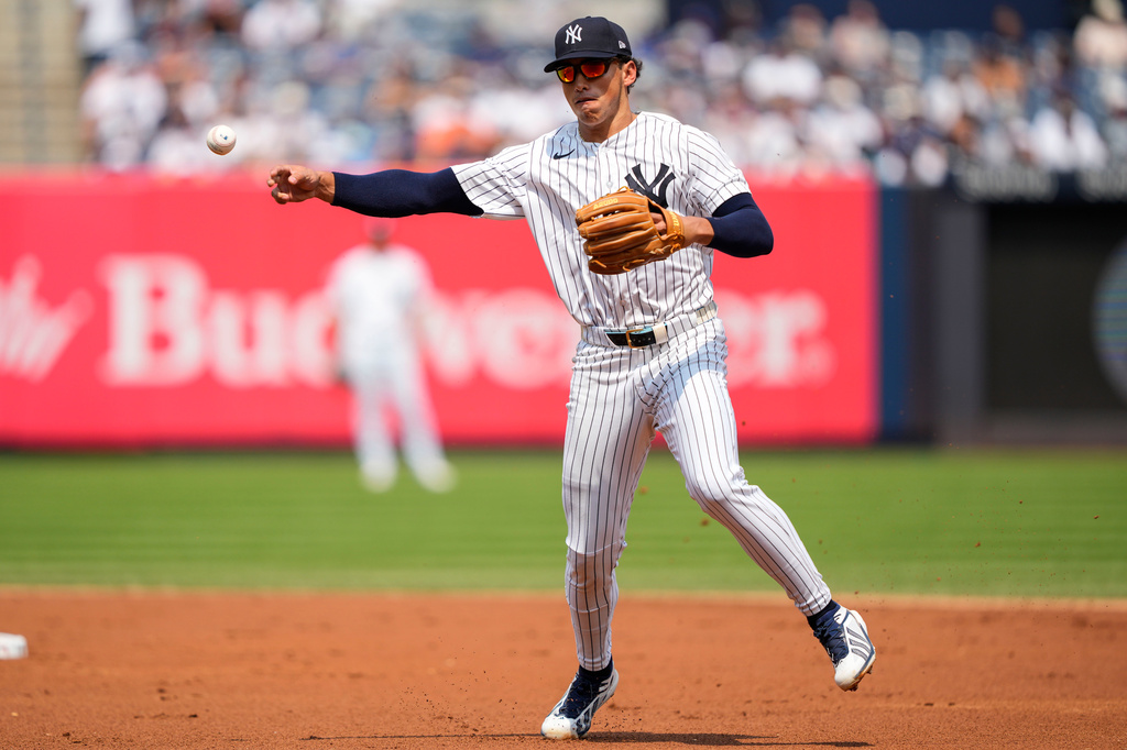 New York Yankees shortstop George Lombard Jr. throws out Seattle Mariners' Brendan Donovan at first base during the second inning of a baseball game, Thursday, Aug. 13, 2026, in New York. (AP Photo/Yuki Iwamura)
