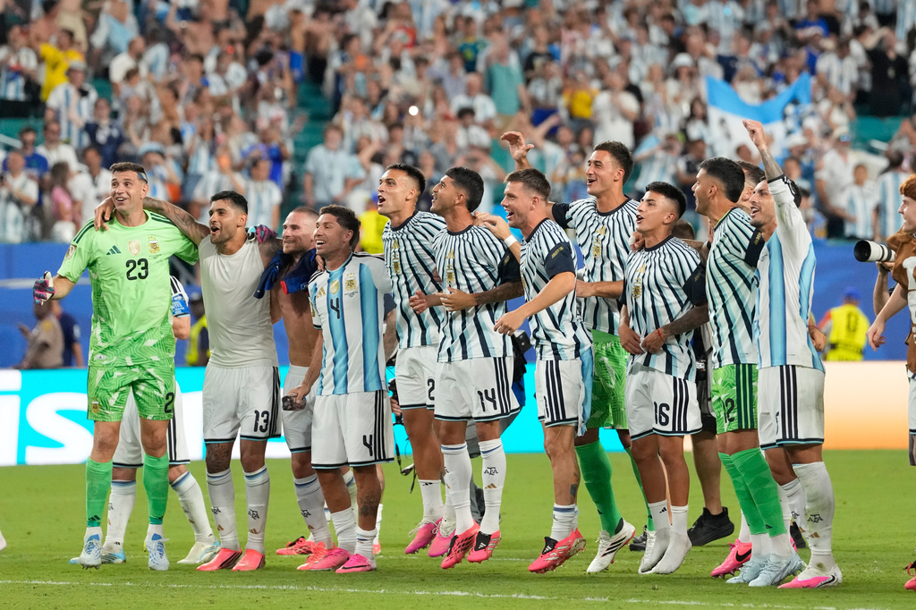 Players of Argentina celebrate after the World Cup round of 32 soccer match against Cape Verde in Miami Gardens, Fla., Friday, July 3, 2026. (AP Photo/Rebecca Blackwell)