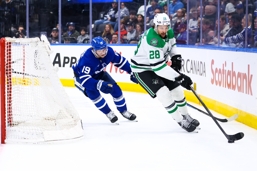 Toronto Maple Leafs center Calle Jarnkrok (19) chases Dallas Stars defenseman Alexander Petrovic (28) who brings the puck around the net during second-period NHL hockey game action in Toronto, Monday, April 13, 2026. (Cole Burston/The Canadian Press via AP)
