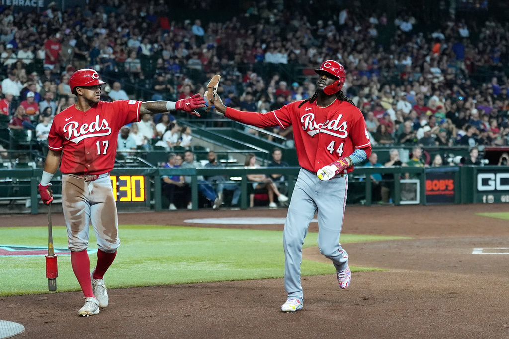 Cincinnati Reds' Elly De La Cruz (44) celebrates his run scored against the Arizona Diamondbacks with Reds' Dane Myers (17) during the third inning of a baseball game, Sunday, Aug. 23, 2026, in Phoenix. (AP Photo/Ross D. Franklin)