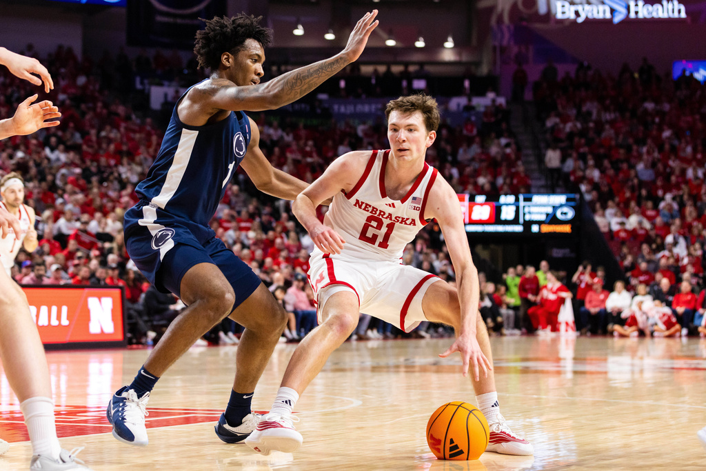 Nebraska forward Pryce Sandfort (21) drives against Penn State forward Mason Blackwood (1) during the first half of an NCAA college basketball game, Saturday, Feb. 21, 2026, in Lincoln, Neb. (AP Photo/Bonnie Ryan)