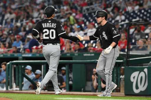 Chicago White Sox' Miguel Vargas (20) is greeted by Kyle Teel, right, after they both scored on a double by Brooks Baldwin during the first inning of a baseball game against the Washington Nationals, Friday, Sept. 26, 2025, in Washington. (AP Photo/Nick Wass) Chicago White Sox' Miguel Vargas (20) is greeted by Kyle Teel, right, after they both scored on a double by Brooks Baldwin during the first inning of a baseball game against the Washington Nationals, Friday, Sept. 26, 2025, in Washington. (AP Photo/Nick Wass)