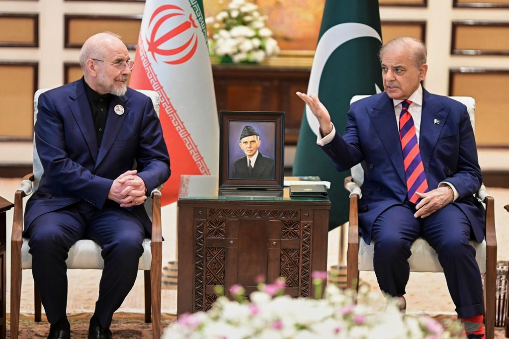 In this photo released by the Pakistan Prime Minister Office, Iran's Parliament Speaker Mohammad Bagher Ghalibaf, left, meets with hand with Pakistani Prime Minister Shehbaz Sharif, in Islamabad, Pakistan, Saturday, April 11, 2026 (Pakistan Prime Minister Office via AP)
