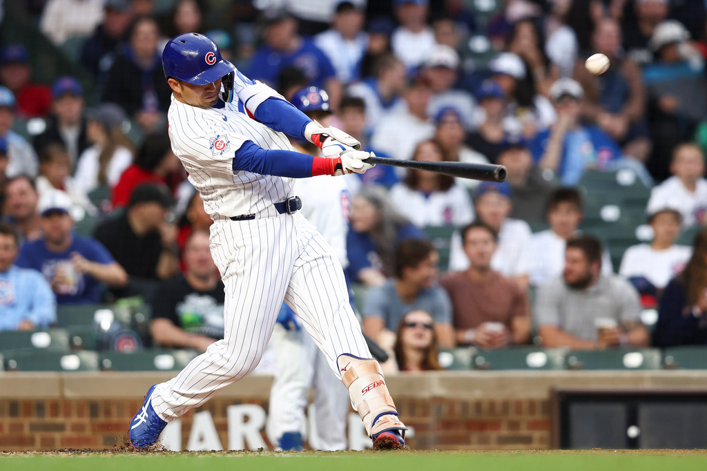 Chicago Cubs designated hitter Seiya Suzuki hits an RBI double during the second of a baseball game against the Colorado Rockies in Chicago, Wednesday, June 17, 2026. (AP Photo/Jessie Alcheh)