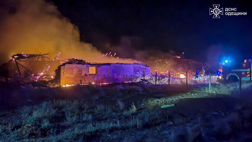 In this photo provided by the Ukrainian Emergency Services on Saturday, Sept. 20, 2025, rescue workers put out a fire of a barn destroyed by a Russian strike in Odesa region, Ukraine. (Ukrainian Emergency Service via AP)