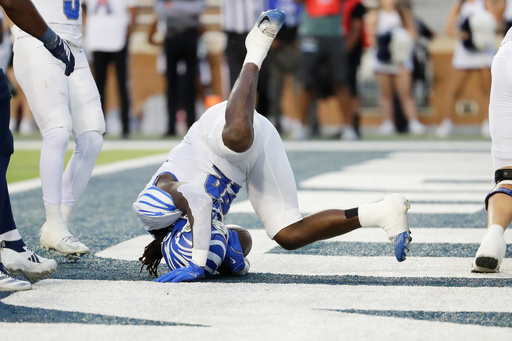 Memphis running back Frank Peasant tumbles into the end zone after breaking the goal line defense to score against Rice during the first half of an NCAA college football game Friday, Oct. 31, 2025, in Houston. (AP Photo/Michael Wyke) Memphis running back Frank Peasant tumbles into the end zone after breaking the goal line defense to score against Rice during the first half of an NCAA college football game Friday, Oct. 31, 2025, in Houston. (AP Photo/Michael Wyke)
