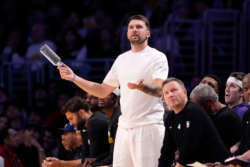 Los Angeles Lakers' Luka Doncic reacts from the bench after the Lakers were called for a foul during the second half in Game 5 of a first-round NBA playoffs basketball series against the Houston Rockets, Wednesday, April 29, 2026, in Los Angeles. (AP Photo/Mark J. Terrill)