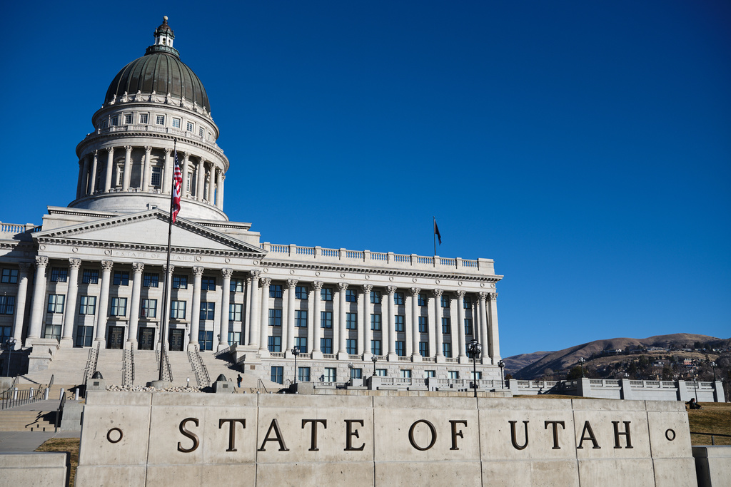 FILE - Flags fly at the Utah State Capitol, Jan. 18, 2026, in Salt Lake City. (AP Photo/Sydney Schaefer, File)