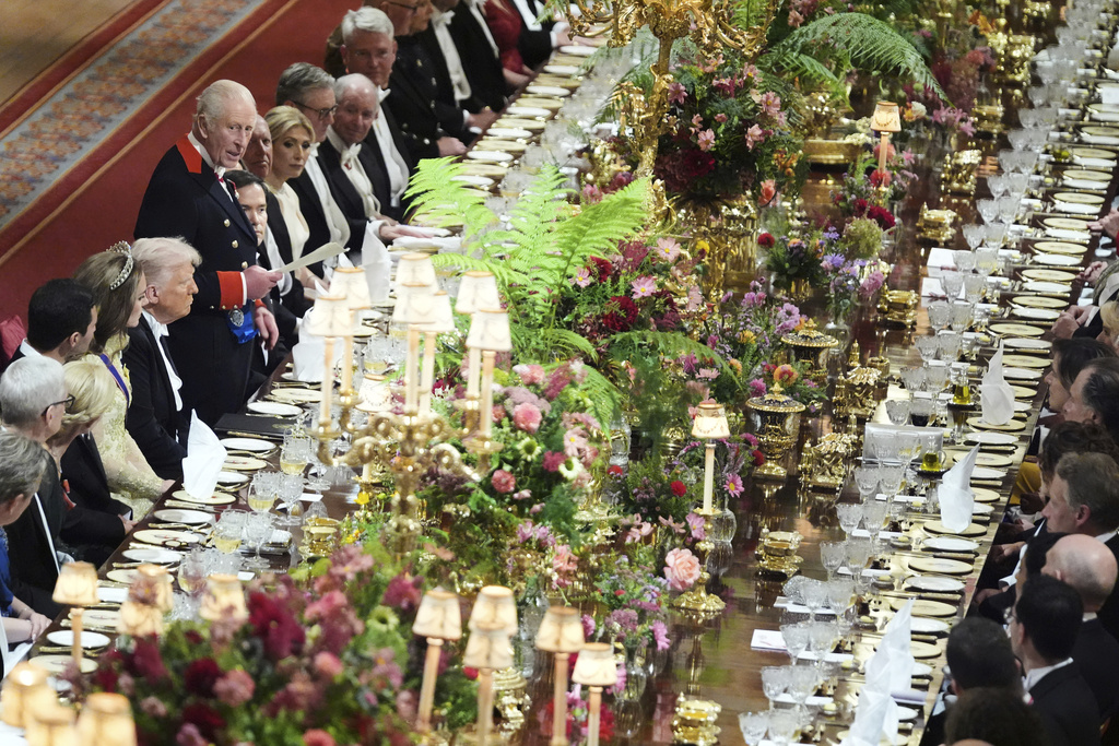Britain's King Charles III, center left, speaks at a State Banquet during a State visit of President Donald Trump at Windsor Castle in Windsor, England, Wednesday, Sept. 17, 2025. (AP Photo/Evan Vucci, Pool)