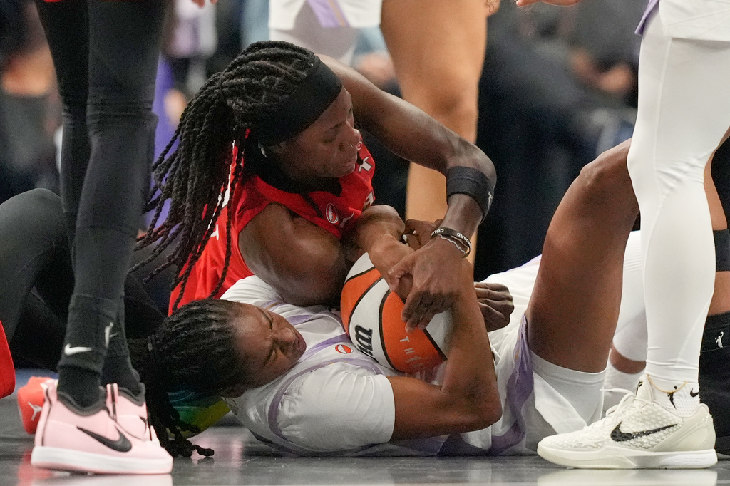 Atlanta Dream's Rhyne Howard, top, and Golden State Valkyries' Tiffany Hayes battle for the ball during the second half of Game 6 of the WNBA basketball finals on Thursday, Oct. 29, 2026, in Atlanta. (AP Photo/Brynn Anderson)