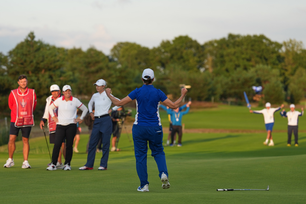 Carlota Ciganda of Europe reacts after holing a putt on the 18th green during the Solheim Cup in Den Bosch, Netherlands, Friday, Sept. 11, 2026. (AP Photo/Alastair Grant)