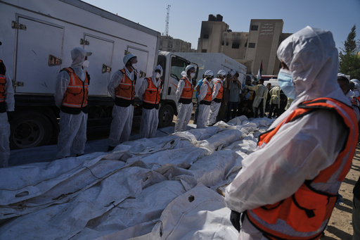 The bodies of unidentified Palestinians, returned from Israel as part of a ceasefire deal, are prepared for a mass funeral, outside Nasser Hospital in Khan Younis, Gaza Strip, Wednesday, Oct. 22, 2025. (AP Photo/Jehad Alshrafi) The bodies of unidentified Palestinians, returned from Israel as part of a ceasefire deal, are prepared for a mass funeral, outside Nasser Hospital in Khan Younis, Gaza Strip, Wednesday, Oct. 22, 2025. (AP Photo/Jehad Alshrafi)