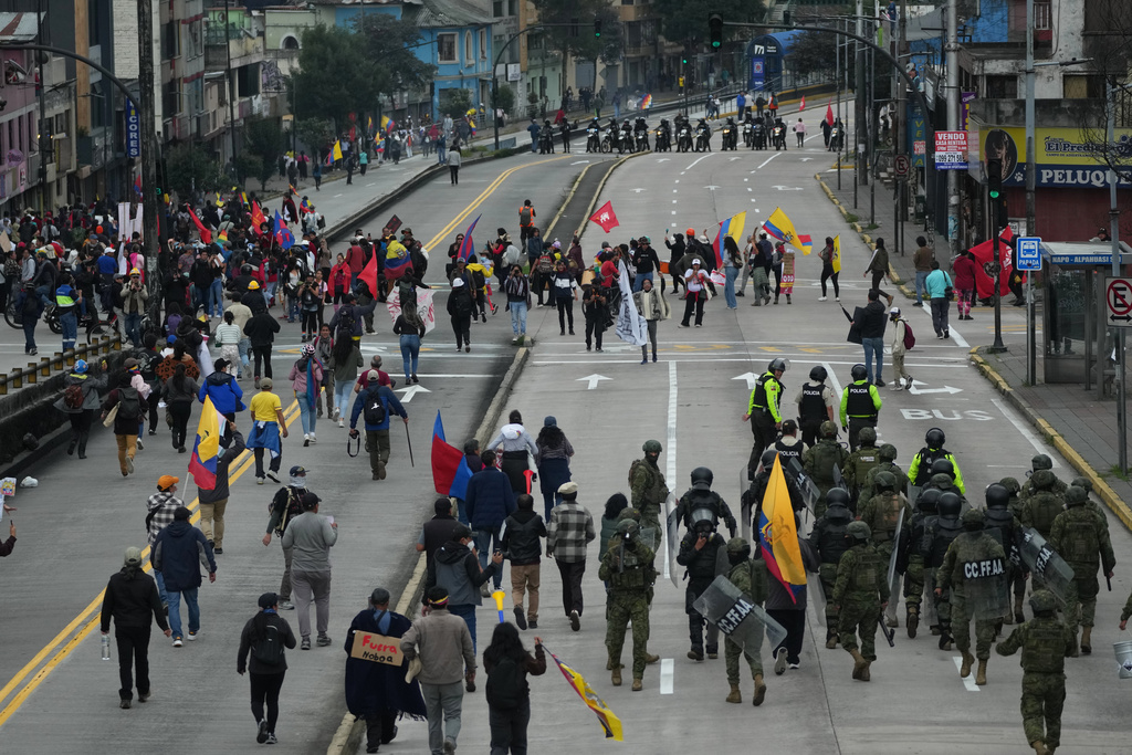 Demonstrators protest President Daniel Noboa's government, in Quito, Ecuador, Sunday, Oct. 12, 2025. (AP Photo/Dolores Ochoa)