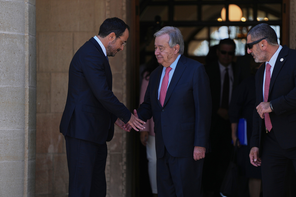 United Nations Secretary General Antonio Guterres, right, shakes hands with Cyprus' President Nikos Christodoulides, as he leaves the presidential palace and after their meeting, in divided capital Nicosia, Cyprus, on Tuesday, July 28, 2026. (AP Photo/Petros Karadjias)