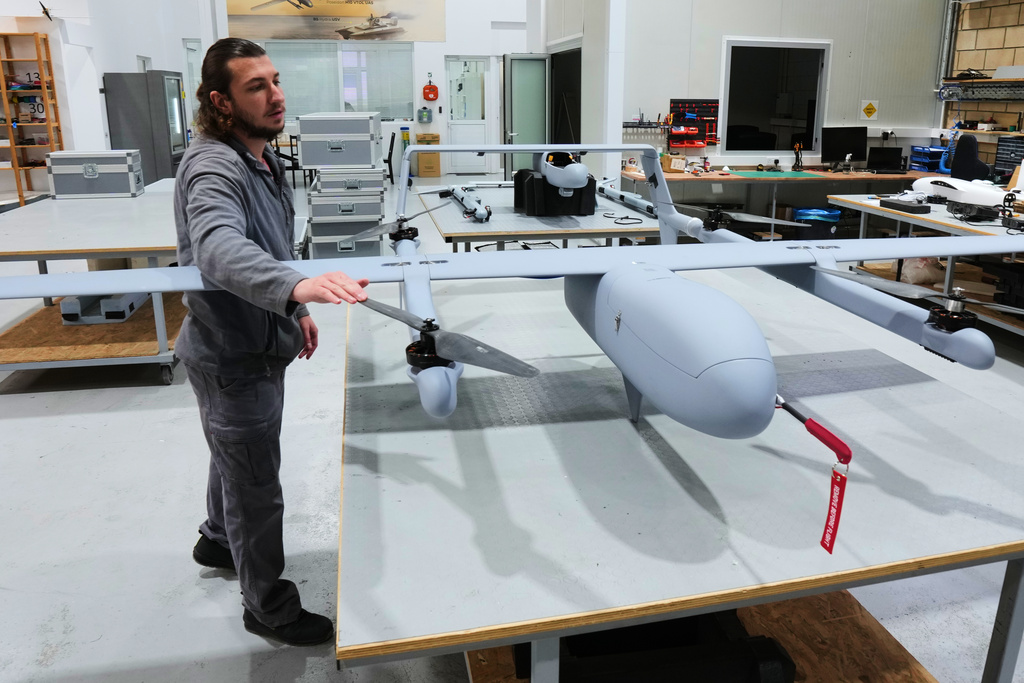 An employee works on an under-construction drone at a manufacturing factory in Limassol, Cyprus, Tuesday, Jan. 27, 2026. (AP Photo/Petros Karadjias)