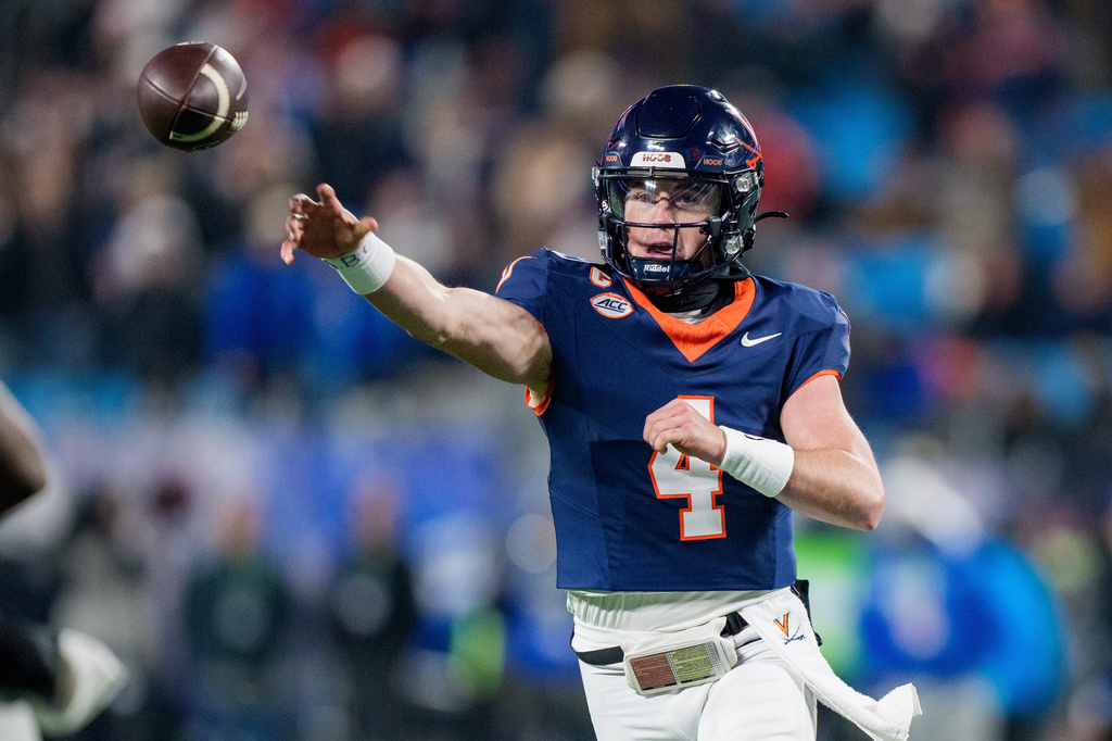 FILE - Virginia quarterback Chandler Morris (4) passes the ball during the Atlantic Coast Conference championship NCAA college football game between Virginia and Duke, Dec. 6, 2025, in Charlotte, N.C. (AP Photo/Jacob Kupferman, File)