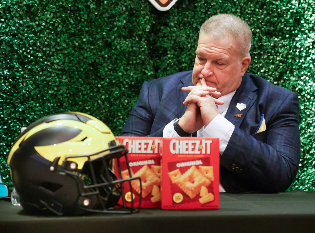Michigan interim head coach Biff Poggi pauses after an NCAA college football Citrus Bowl news conference in Winter Park, Fla., Monday, Dec. 15, 2025, ahead of his team's New Year's Eve appearance against Texas in the bowl in Orlando, Fla. (Joe Burbank/Orlando Sentinel via AP)