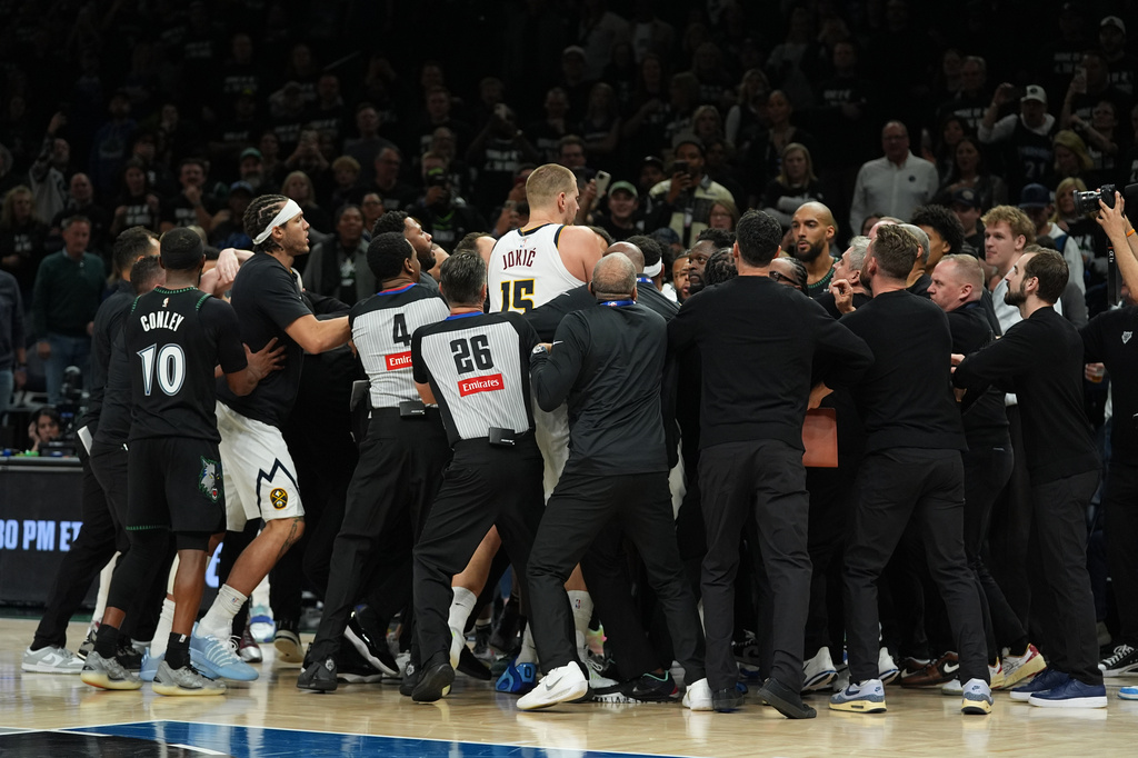 Minnesota Timberwolves and Denver Nuggets players get into an altercation during the second half of Game 4 of a first-round NBA basketball playoff series, Saturday, April 25, 2026, in Minneapolis. (AP Photo/Abbie Parr)