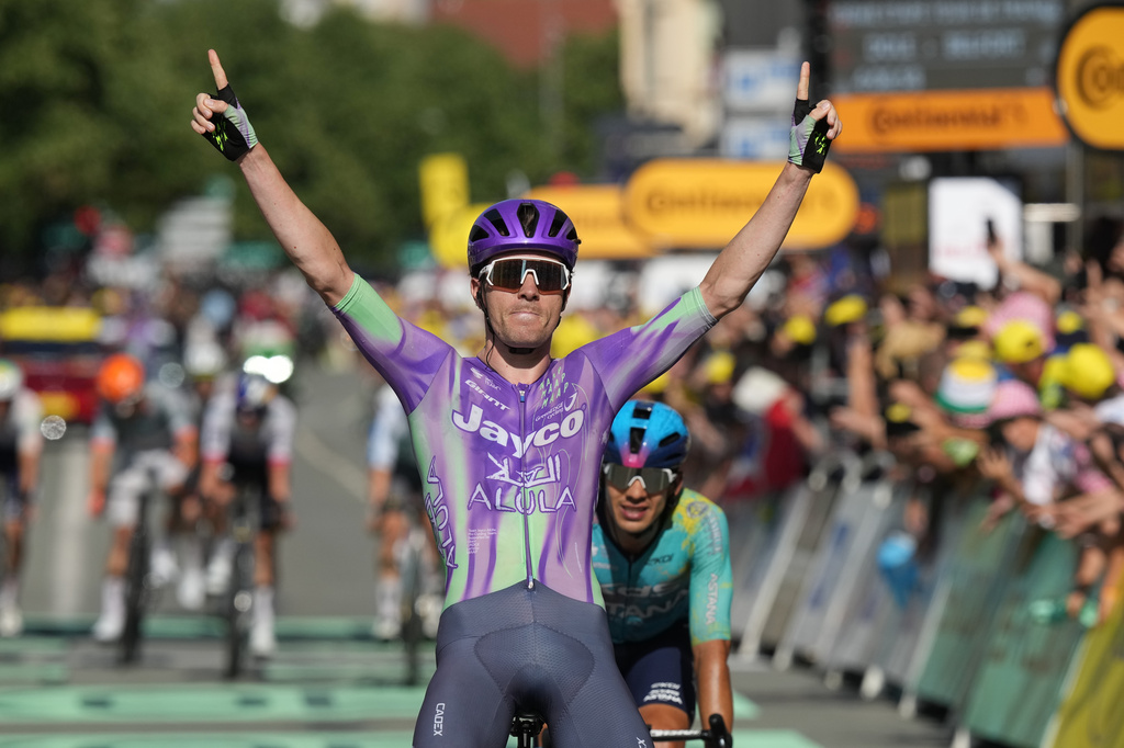 Switzerland's Mauro Schmid crosses the finish line to win the thirteenth stage of the Tour de France cycling race with start in Dole and finish in Belfort, France, Friday, July 17, 2026. (AP Photo/Thibault Camus)