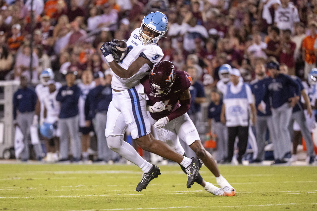 Old Dominion tight end Jailen Butler (9) is tackled by Virginia Tech cornerback Krystian Williams (4) during the first half of an NCAA college football game Saturday, Sept. 13, 2025, in Blacksburg, Va. (AP Photo/Robert Simmons)