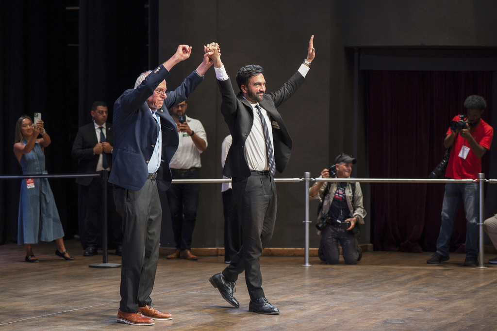 Sen. Bernie Sanders, I-Vt., left, and New York City mayoral candidate Zohran Mamdani greet the crowd during a town hall on Saturday, Sept, 6, 2025, in New York. (AP Photo/Olga Fedorova)