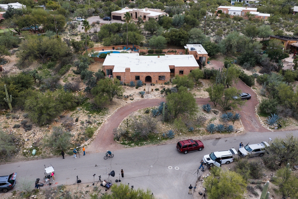 Members of the press work outside the home of Nancy Guthrie, the missing mother of “Today” show host Savannah Guthrie, Thursday, Feb. 5, 2026, in Tucson, Ariz. (AP Photo/Caitlin O'Hara)