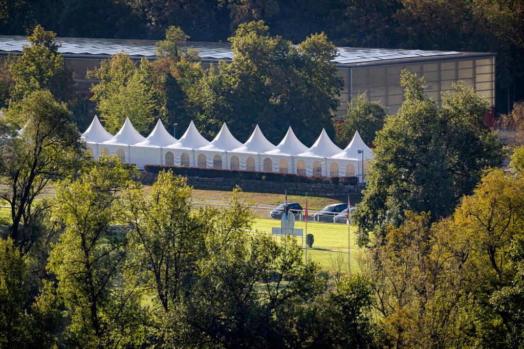A general view shows the area of Schachen horse racing track, where a shooting occurred earlier during a rave event, in Aarau, Switzerland, Sunday, Aug. 30, 2026. (Michael Buholzer/Keystone via AP)