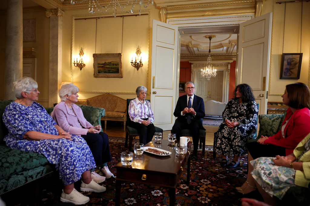 Britain's Prime Minister Keir Starmer, center, attends a meeting with campaigners to discuss historical forced adoption, at Downing Street, in London, Thursday July 2, 2026. (Isabel Infantes/Pool Photo via AP)