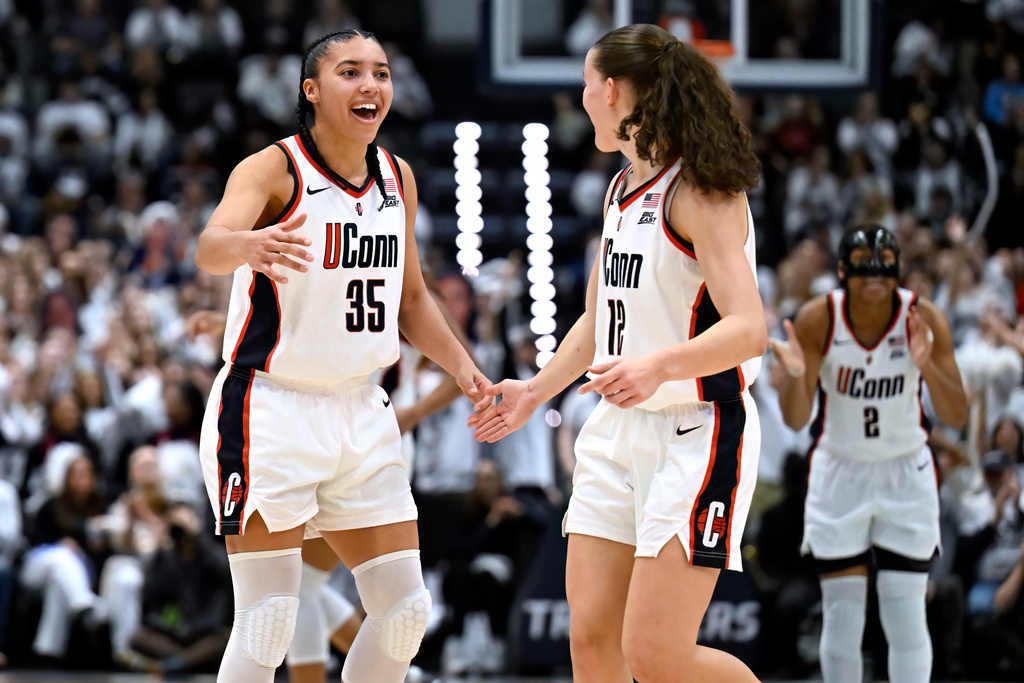 UConn guard Azzi Fudd (35) celebrates with guard Ashlynn Shade (12) in the second half of an NCAA college basketball game against Tennessee, Sunday, Feb. 1, 2026, in Hartford, Conn. (AP Photo/Jessica Hill)