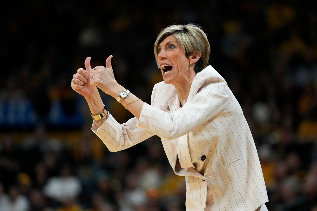 Iowa head coach Jan Jensen reacts to her team during the first half against Virginia in the second round of the NCAA college basketball tournament, Monday, March 23, 2026, in Iowa City, Iowa. (AP Photo/Charlie Neibergall)